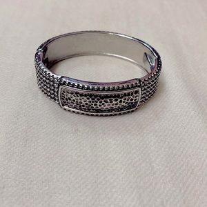 Silver tone hinged bracelet